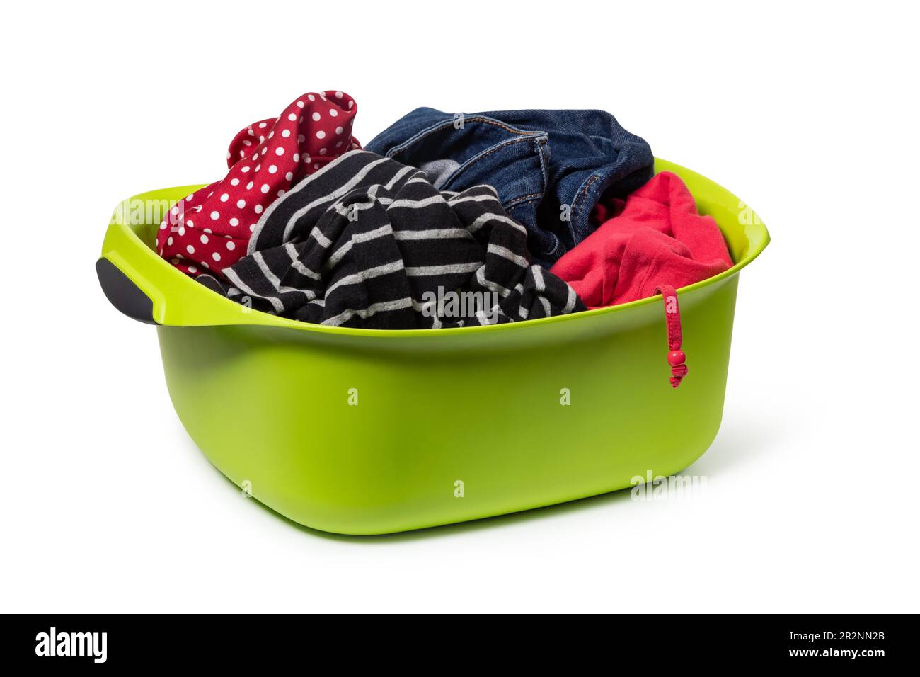 green plastic wash bowl with clothing isolated on white background