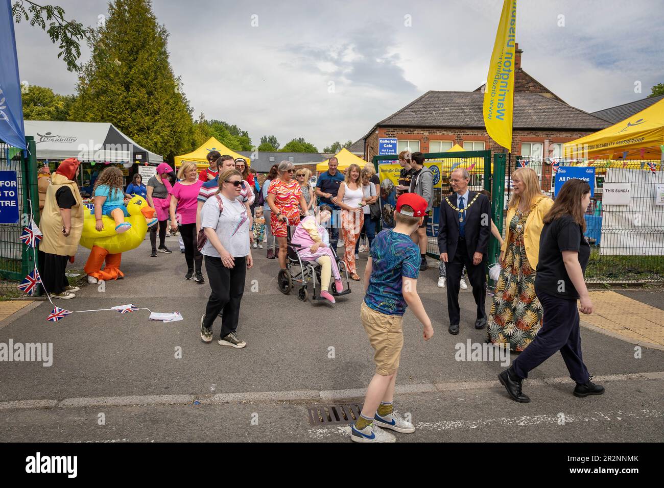 Warrington Disability Partnership held a fancy dress 'Walk in the Park-Coronation Edition' to raise funds for charity. Each participant received a ‘li Stock Photo