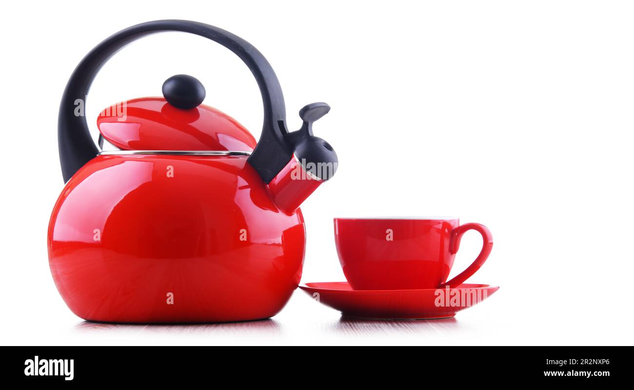 Cup of coffee and stainless steel stovetop kettle with whistle isolated on white Stock Photo