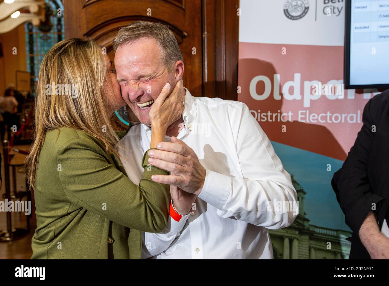 Sinn Fein’s JJ Magee (right) is given a celebration kiss on the cheek by fellow candidate Nichola Bradley at Belfast City Hall during the Northern Ireland council elections. Picture date: Saturday May 20, 2023. Stock Photo