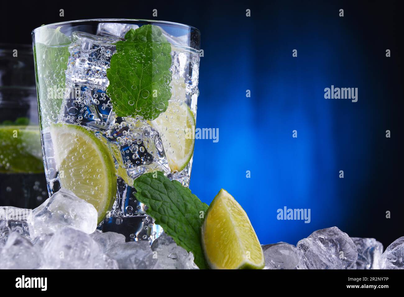 Glass of mineral water with ice, lime and mint Stock Photo - Alamy