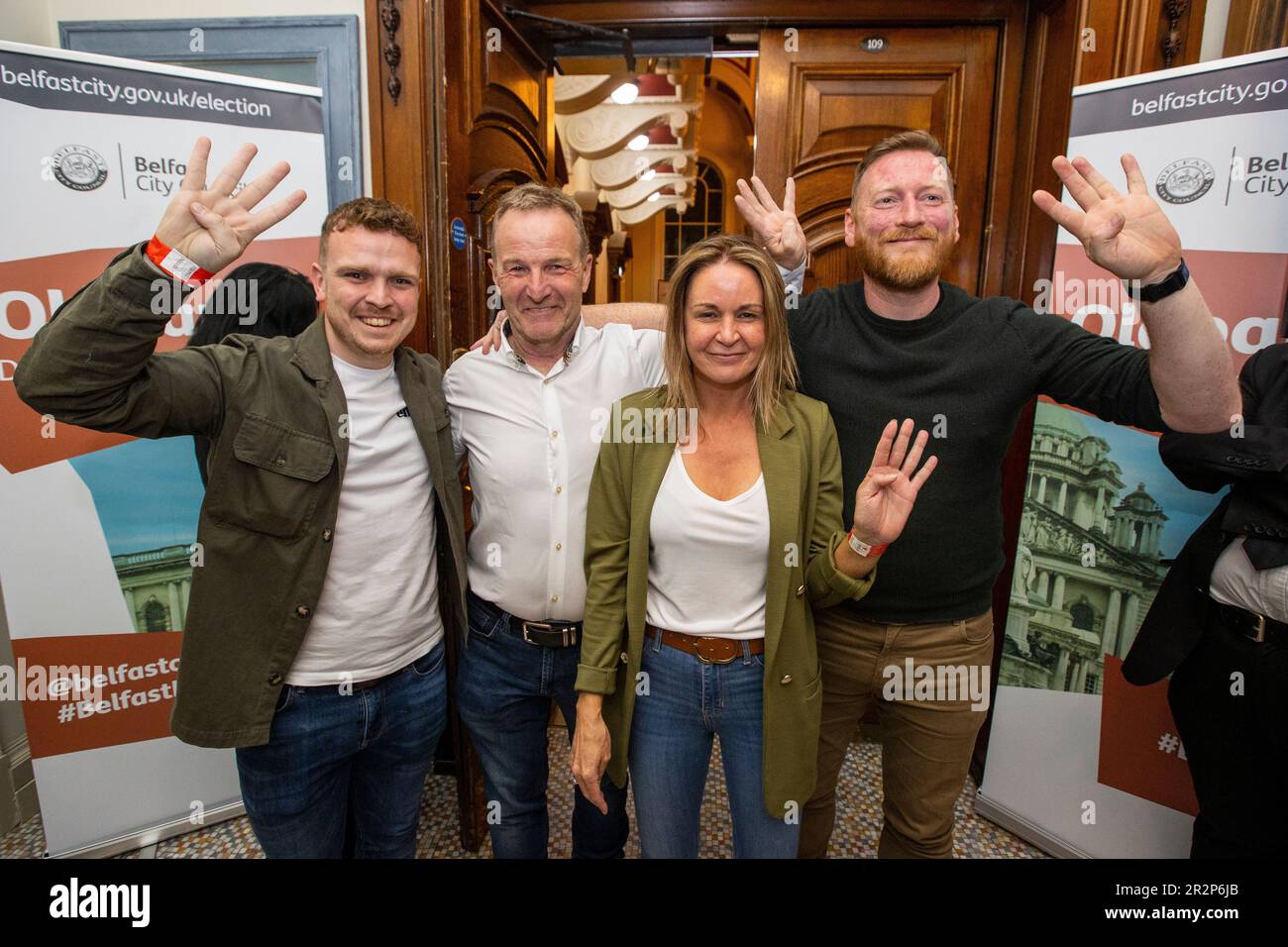 (from left) Sinn Fein’s Ryan Murphy, JJ Magee, Nichola Bradley, and Tomas O Neill hold up four fingers after all four won seats in Oldpark at Belfast City Hall during the Northern Ireland council elections. Picture date: Saturday May 20, 2023. Stock Photo