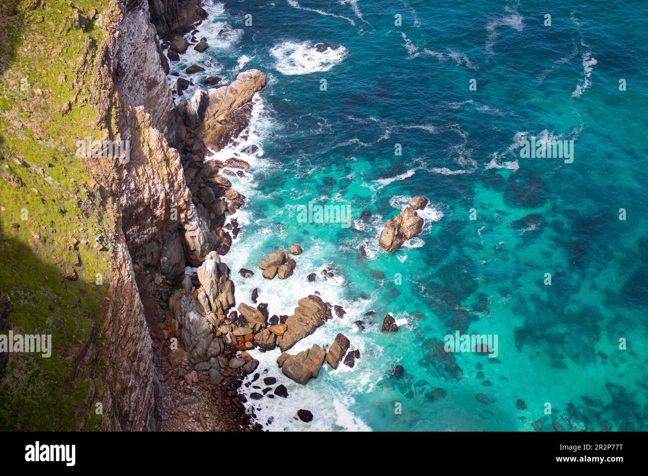 Ocean and rocks around Cape Point Lighthouse, Cape Point, South Africa Stock Photo