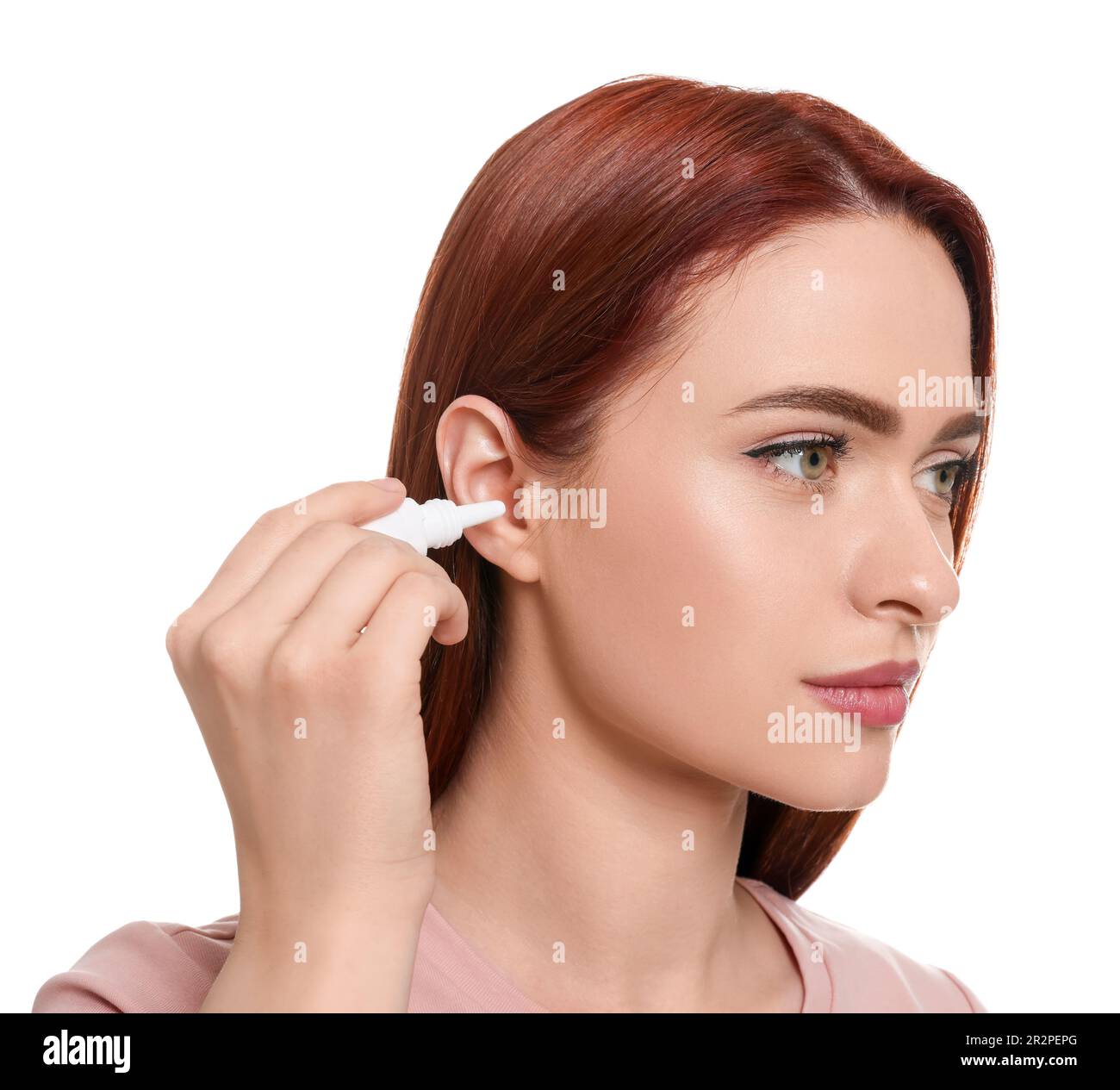 Woman using ear drops on white background Stock Photo Alamy