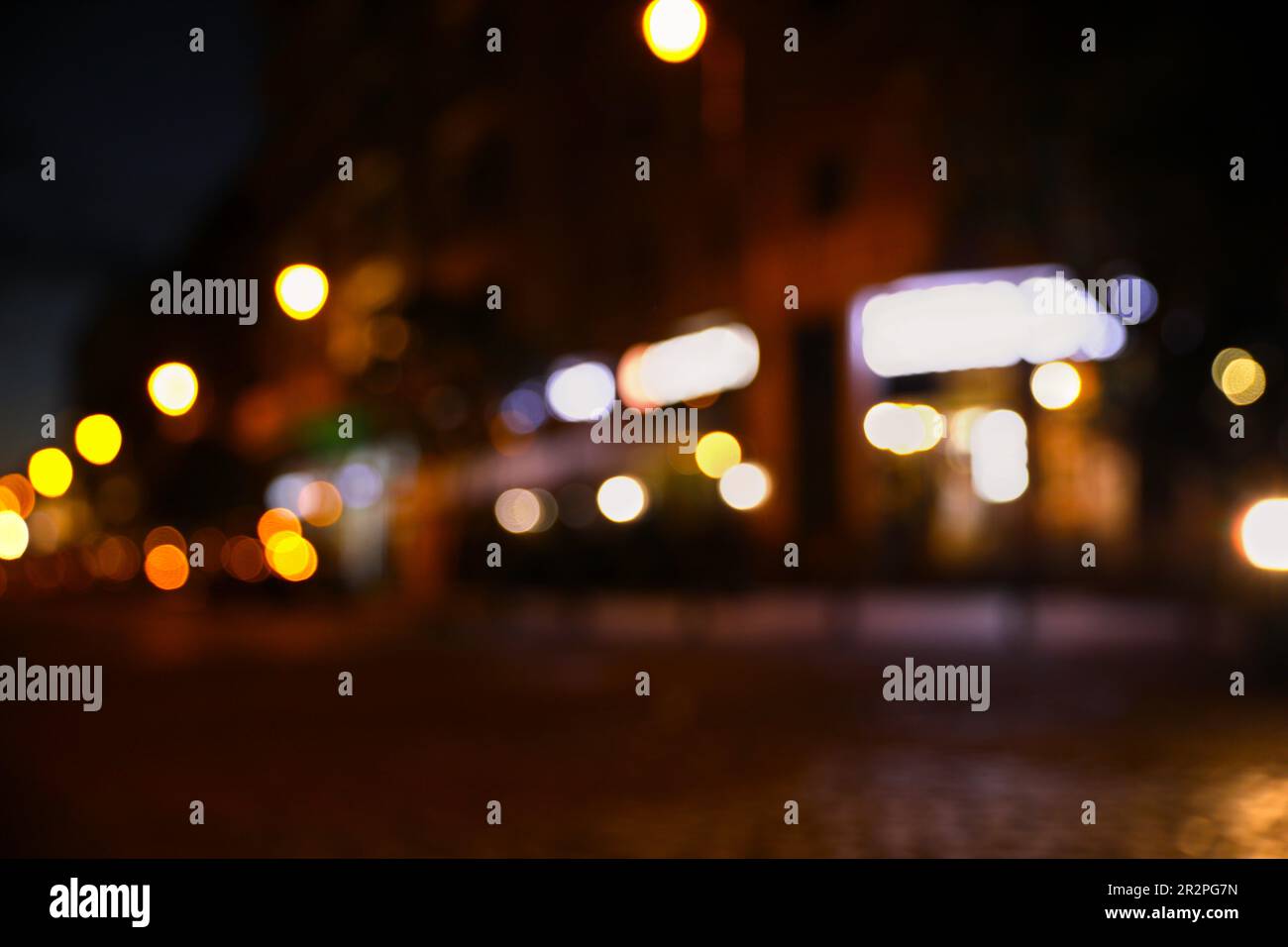 Blurred view of city street with lights at night. Bokeh effect Stock ...