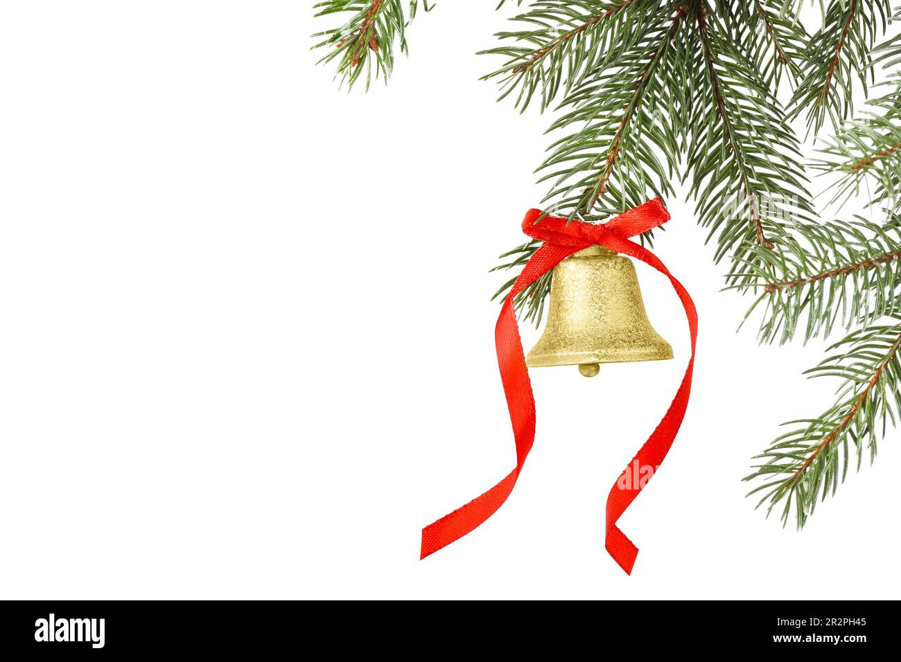 Christmas bell with red bow hanging on fir tree branch against white ...