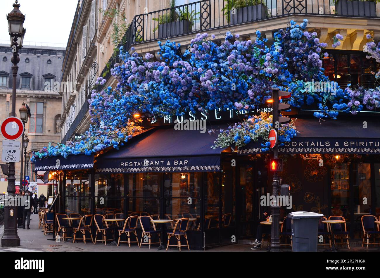 Paris, France - December 10, 2022: Exterior of Le Musset restaurant decorated with beautiful blue hydrangea flowers Stock Photo