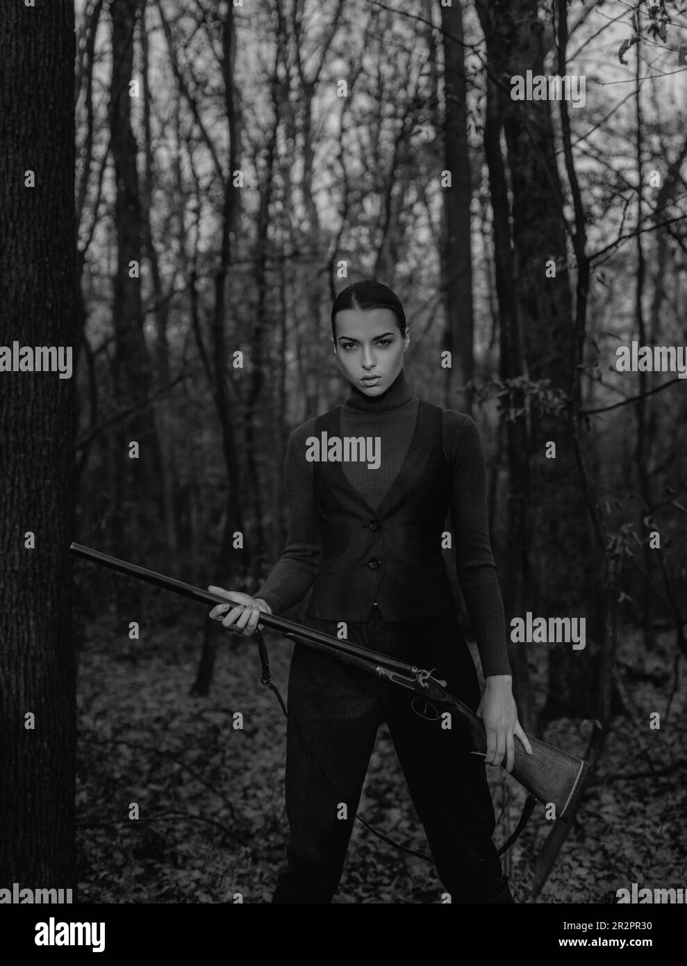 female hunter in forest. successful hunt. hunting sport. military fashion. achievements of goals. girl with rifle. chase hunting. Gun shop. woman with Stock Photo