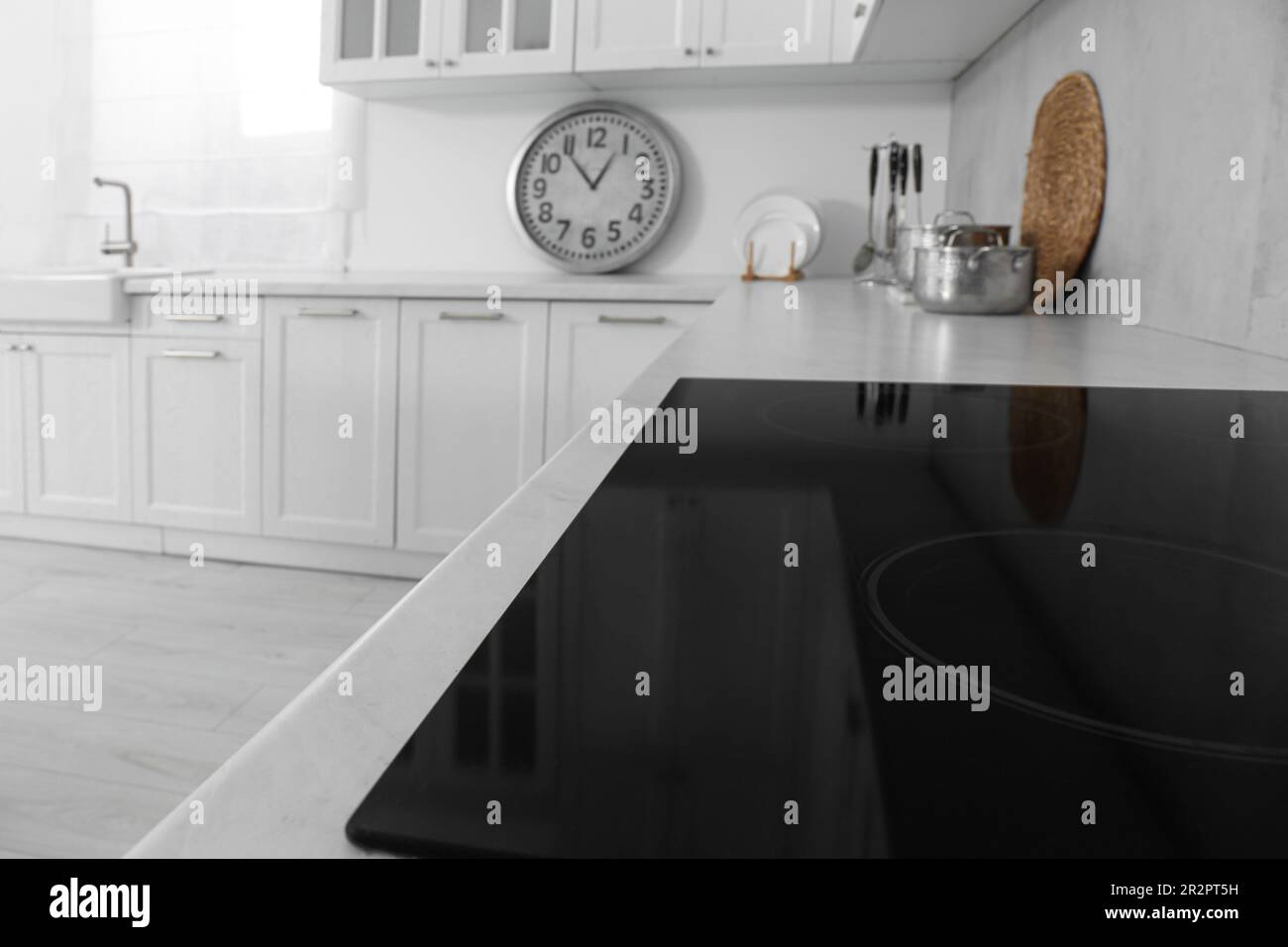 Modern inductive cooktop in kitchen. Interior design Stock Photo