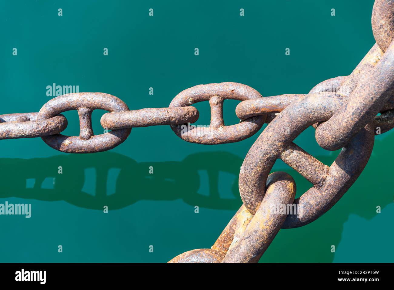 The closeup perspective of deployed heavy stud link anchor chain Stock