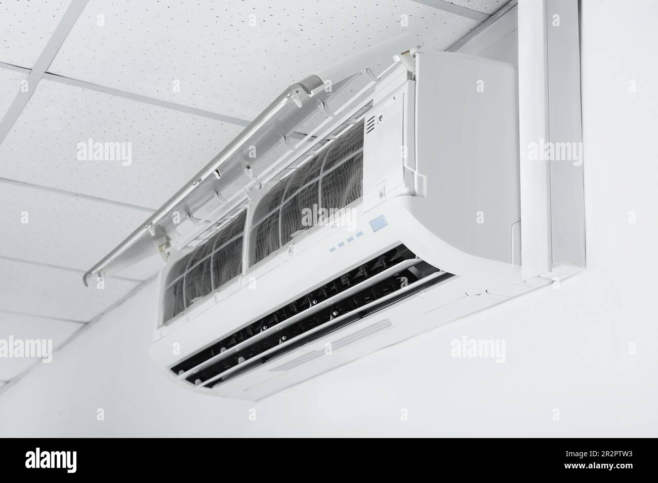 Modern air conditioner hanging on white wall Stock Photo Alamy