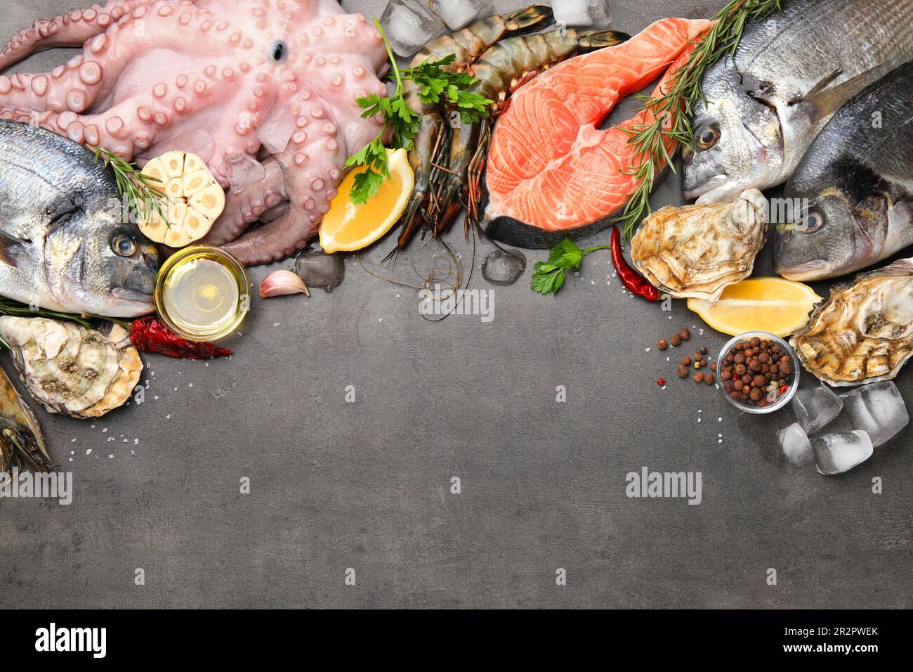 Flat lay composition with fresh raw dorado fish and different seafood ...