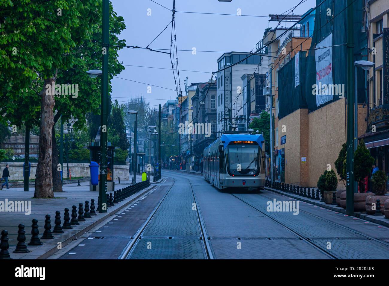 Tram on street, fogy morning,Sultan Ahmet, Historic Areas of Istanbul, Sultanahmet square, Istanbul, Turkey Stock Photo