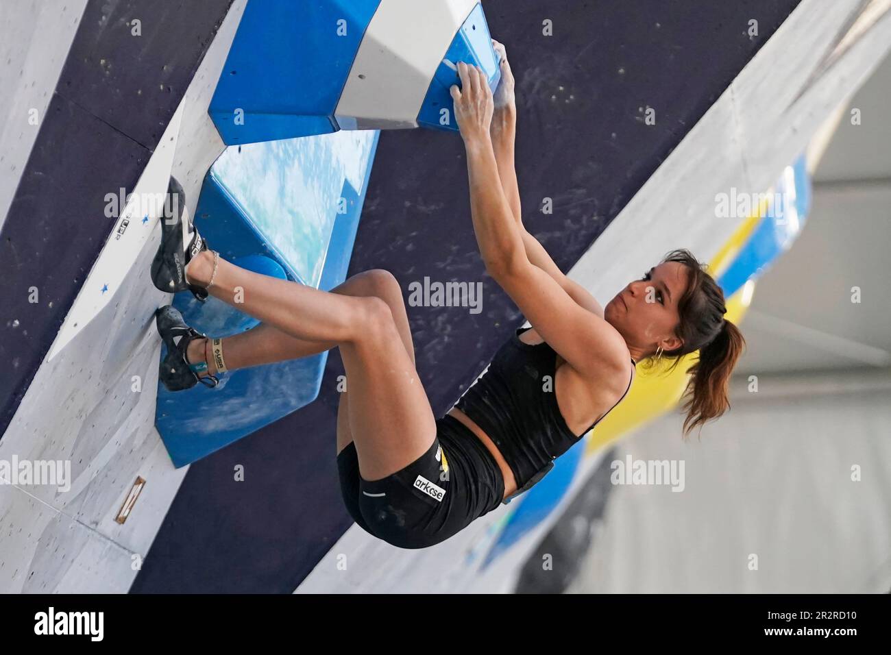 Oriane Bertone, of France, competes during the women's boulder finals