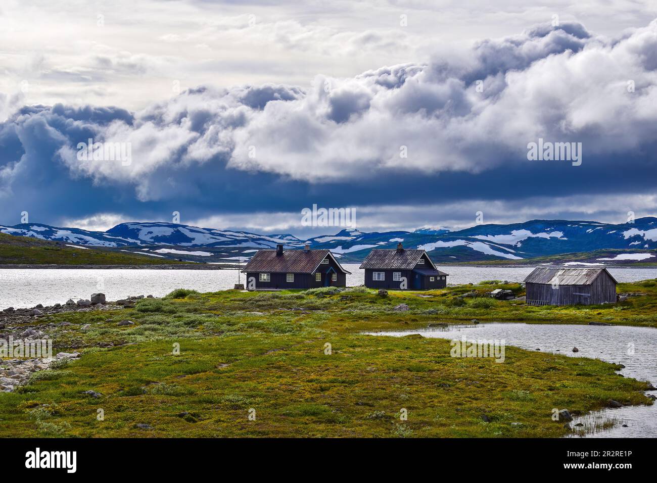 Wooden houses by the lake, barren mountain fjord landscape, Buskerud, Norway, Scandinavia, Europe Stock Photo