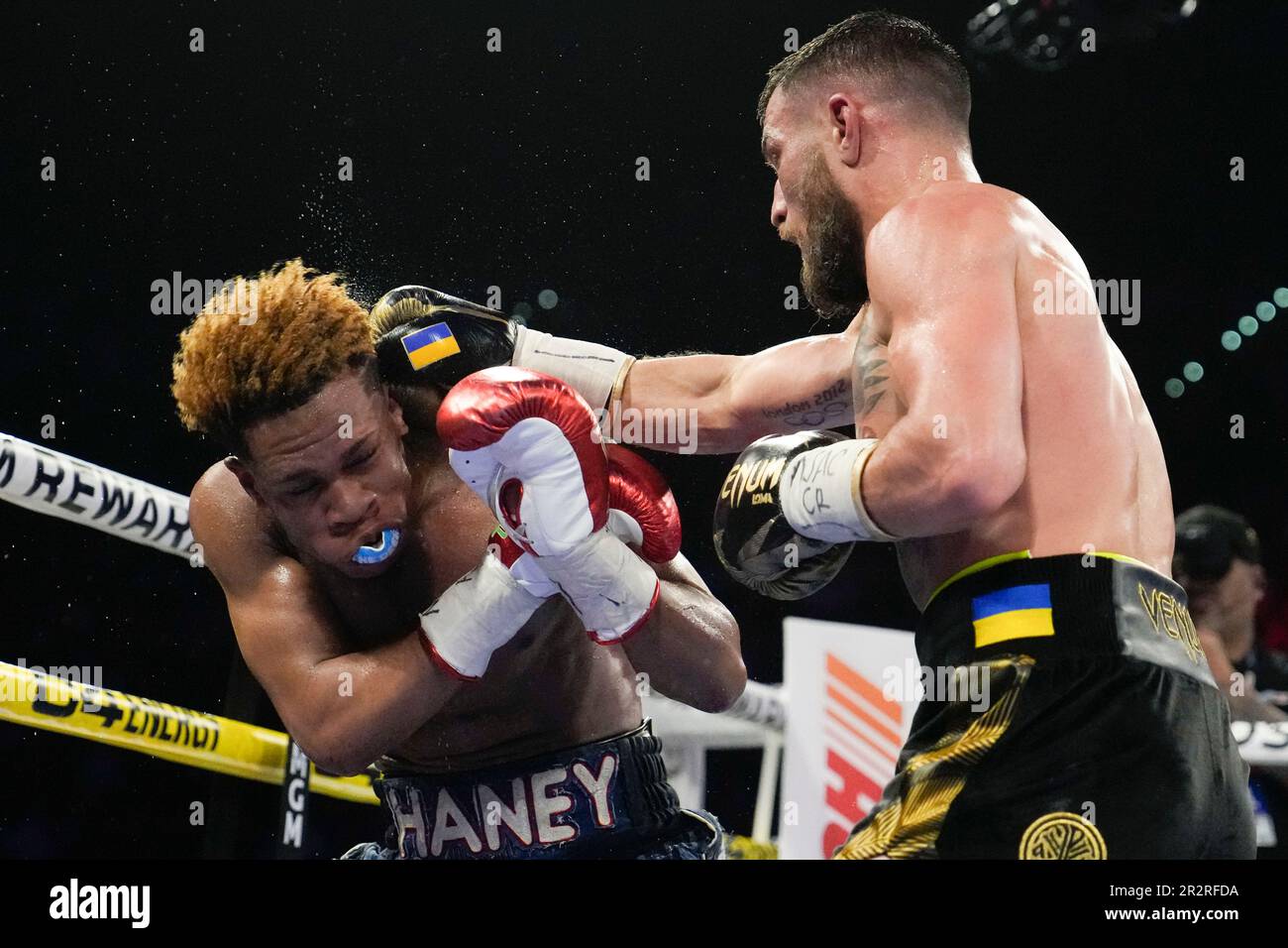 Devin Haney, left, fights Vasiliy Lomachenko in an undisputed lightweight championship boxing match Saturday, May 20, 2023, in Las Vegas