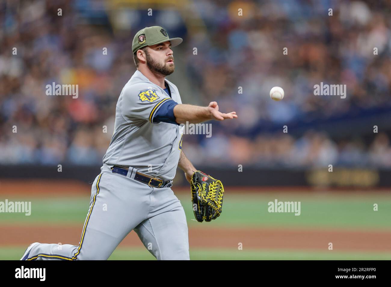 St. Petersburg, FL USA; Milwaukee Brewers relief pitcher Bryse Wilson (46) fields a ball and tosses to first base for the out during an MLB game again Stock Photo