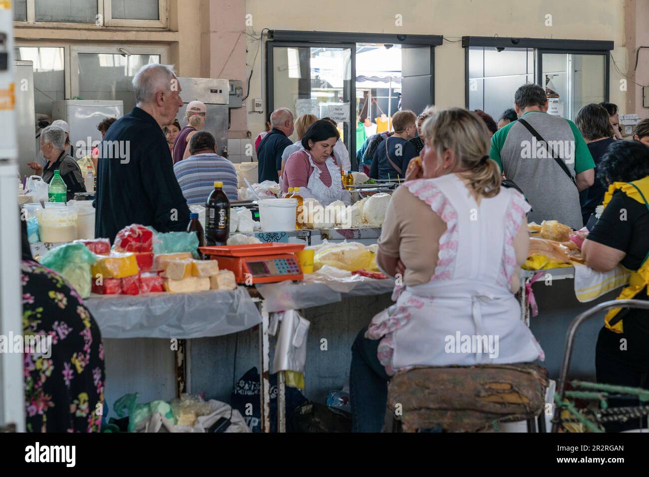 Vendor is selling dairy products on famous farmer market Pryvoz established in 1827 in Odesa, Ukraine on May 20, 2023 Stock Photo