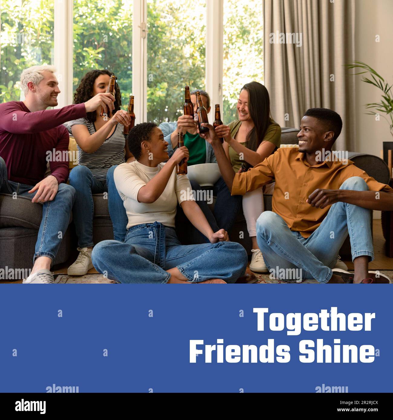Composition of happy friendship day text over happy diverse friends drinking beer Stock Photo