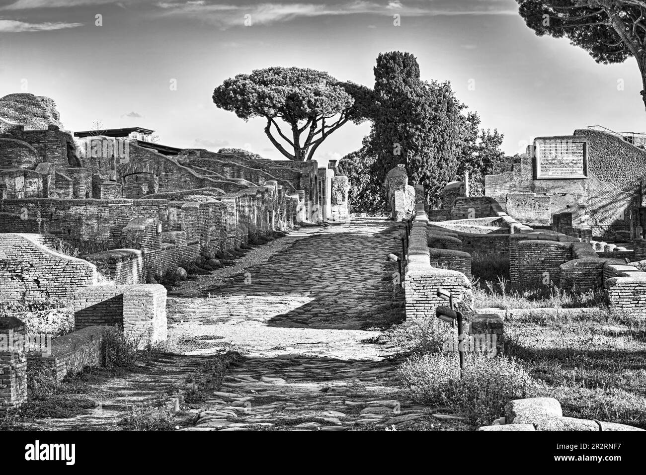 Ancient Rome urban street view at archaeological roman ruins of Ancient Ostia in Rome - Italy Stock Photo