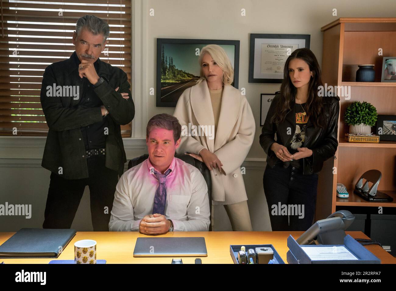 PIERCE BROSNAN, ELLEN BARKIN, NINA DOBREV and ADAM DEVINE in THE OUT-LAWS (2023), directed by TYLER SPINDEL. Credit: HAPPY MADISON PRODUCTIONS / Album Stock Photo