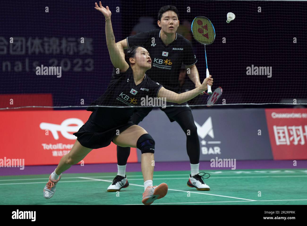 Chae Yu Jung of South Korea returns a shot with teammate Seo Seung Jae during their mixed doubles badminton final match against Zheng Siwei and Huang Yaqiong of China at the BWF