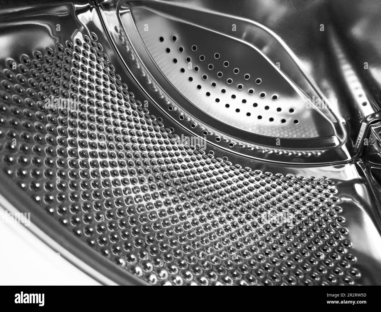 Washing machine drum close up. Washing machine background. Inside the