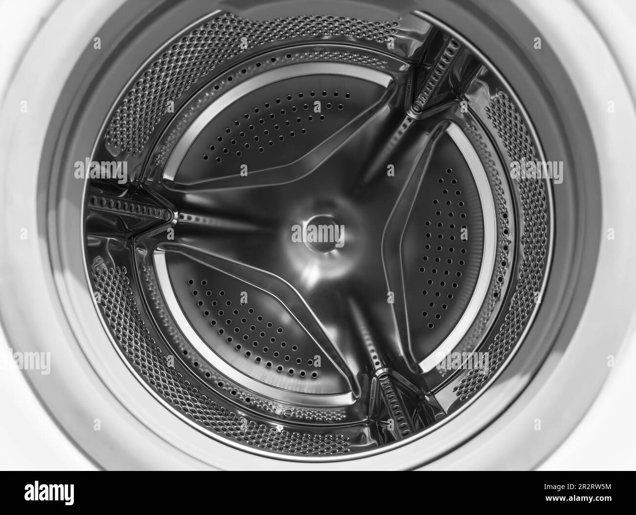 Washing machine drum close up. Washing machine background. Inside the