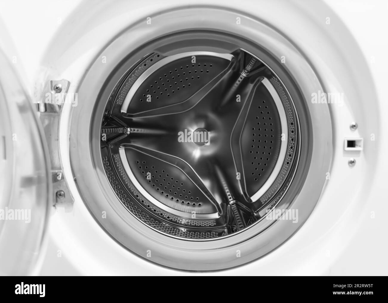Washing machine drum close up. Washing machine background. Inside the