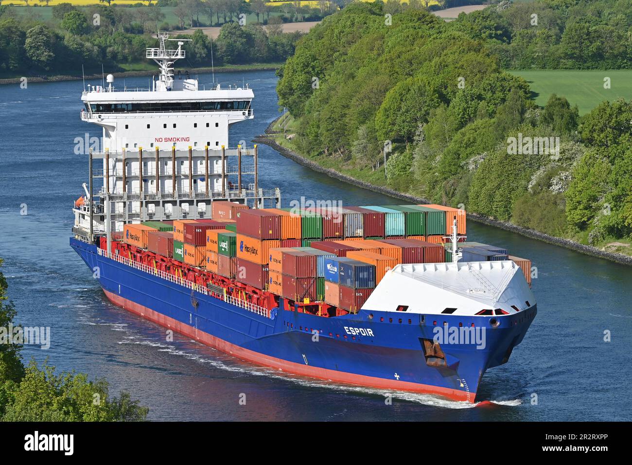 Containership ESPOIR passing the Kiel Canal Stock Photo