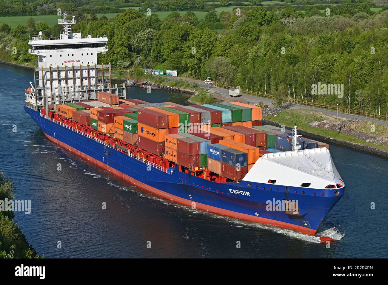 Containership ESPOIR passing the Kiel Canal Stock Photo