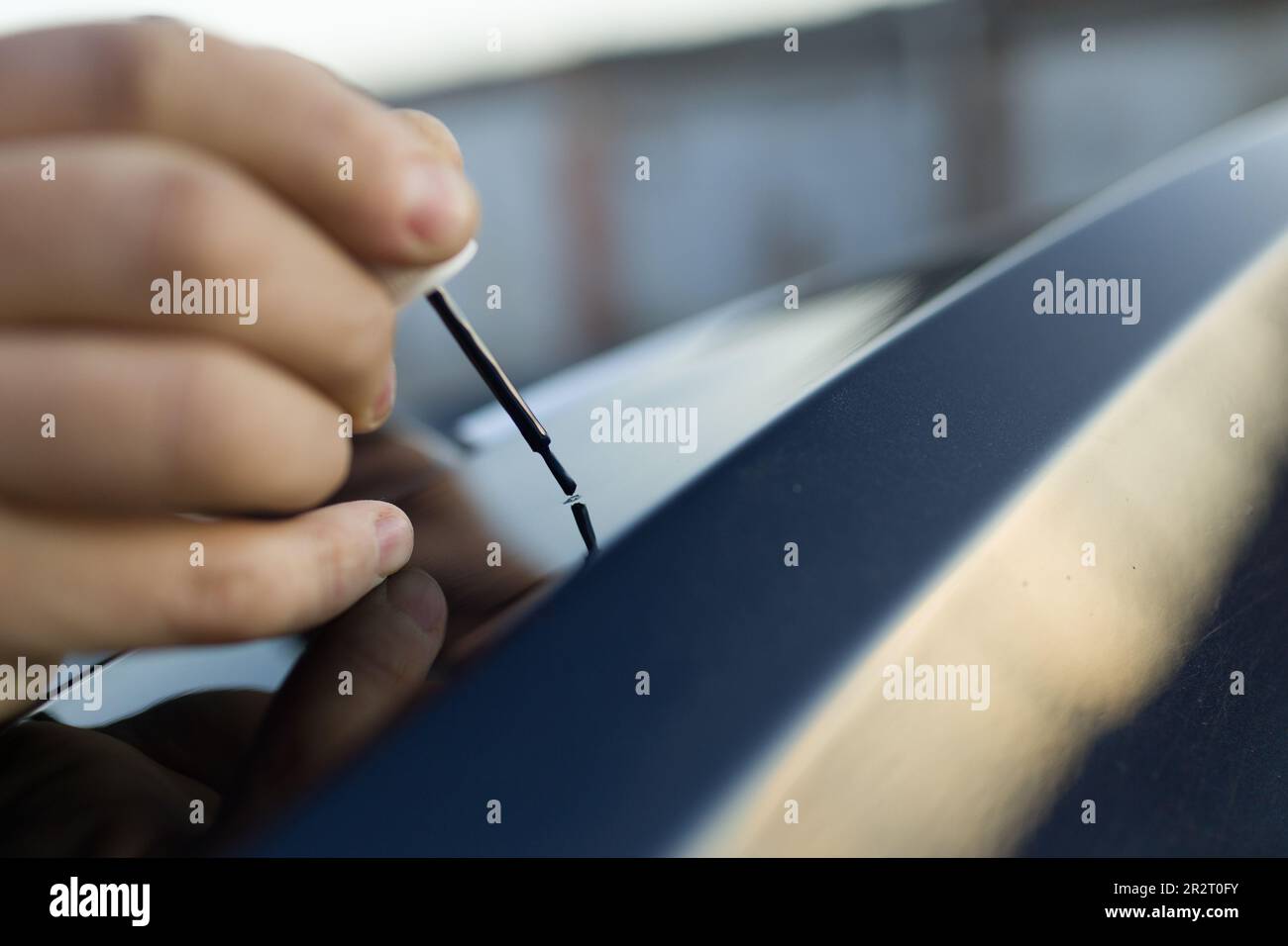 Brush painting small scratches chip car vehicle detailing paint Stock