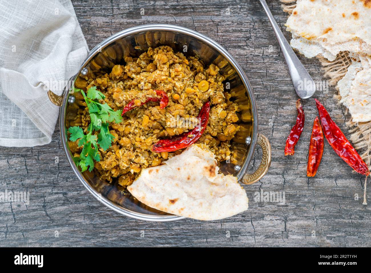 Bengal coconut dal curry with roti Stock Photo - Alamy