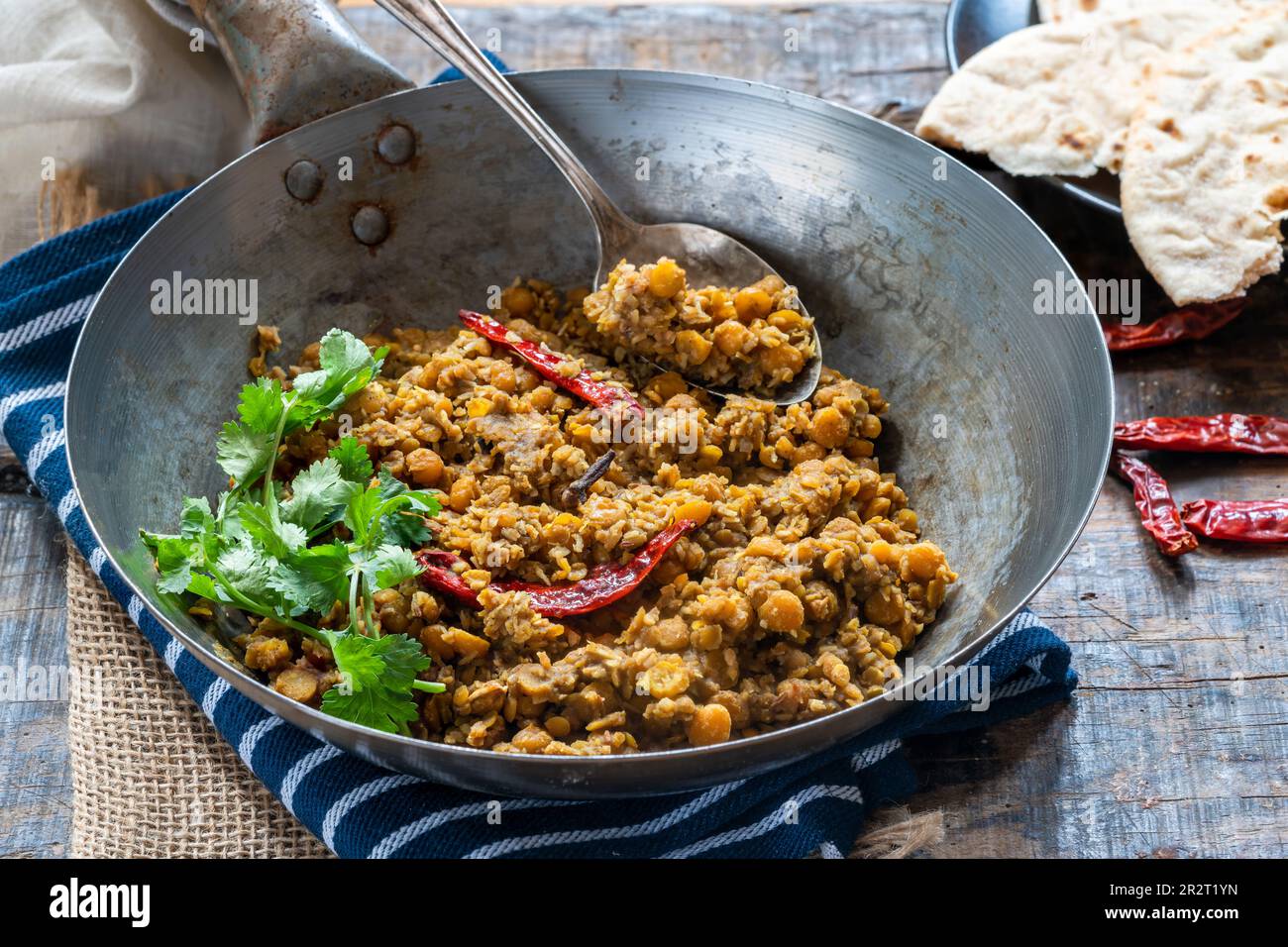 Bengal coconut dal curry with roti Stock Photo - Alamy