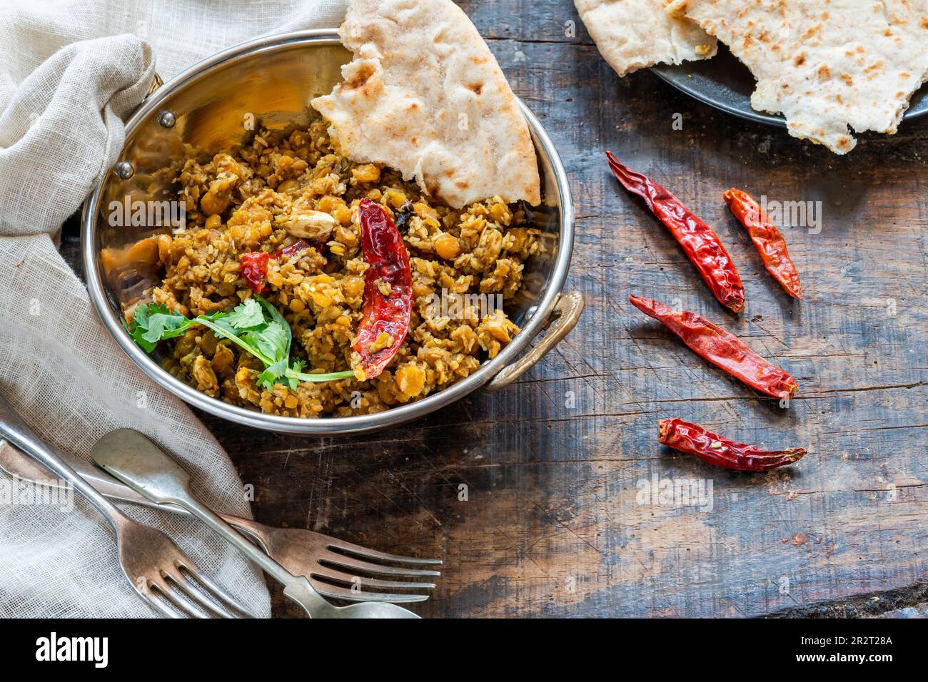 Bengal coconut dal curry with roti Stock Photo - Alamy