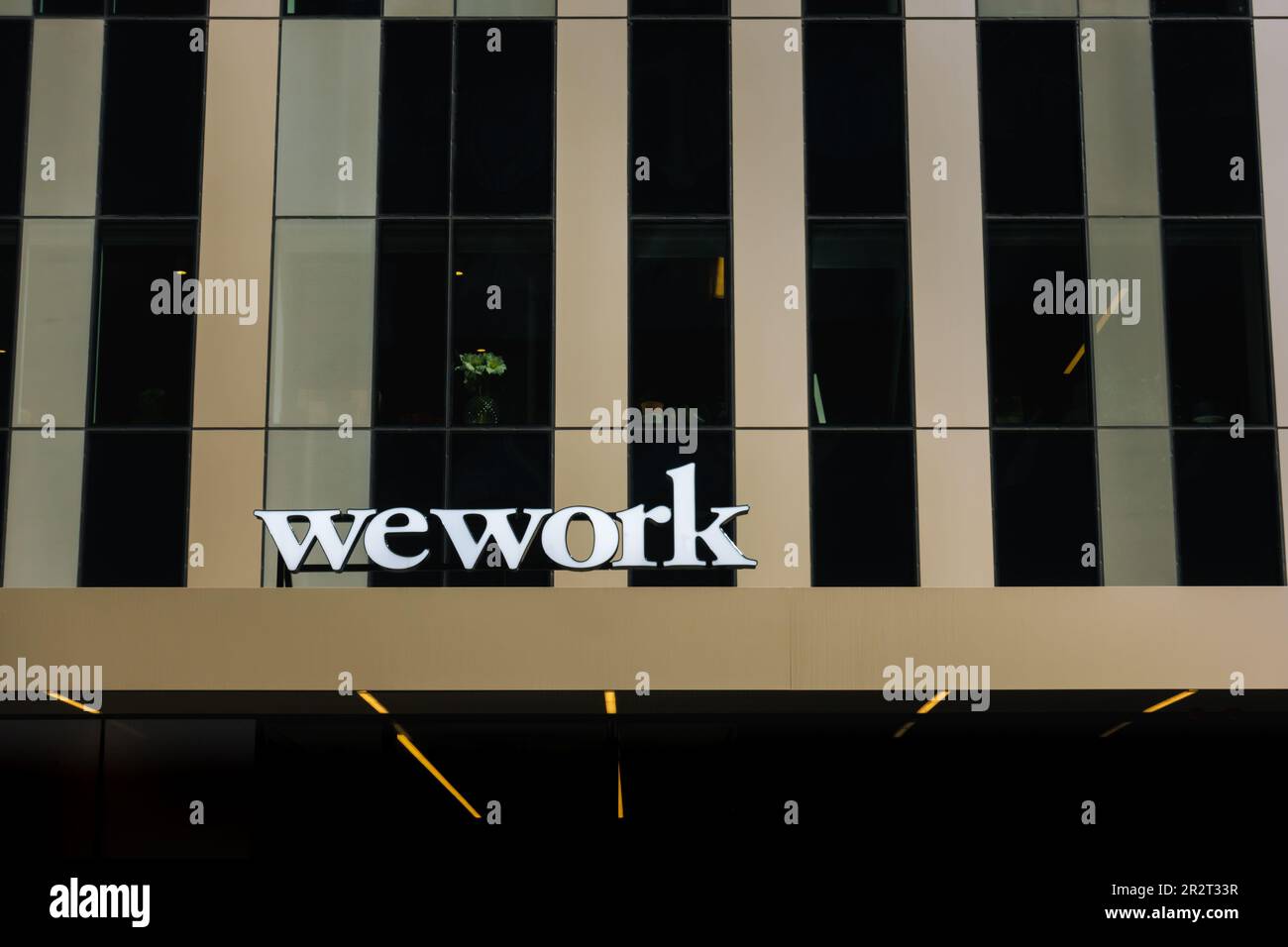 Stockholm, Sweden - 4 May 2023: WeWork logo on modern office building in urban city environment Stock Photo