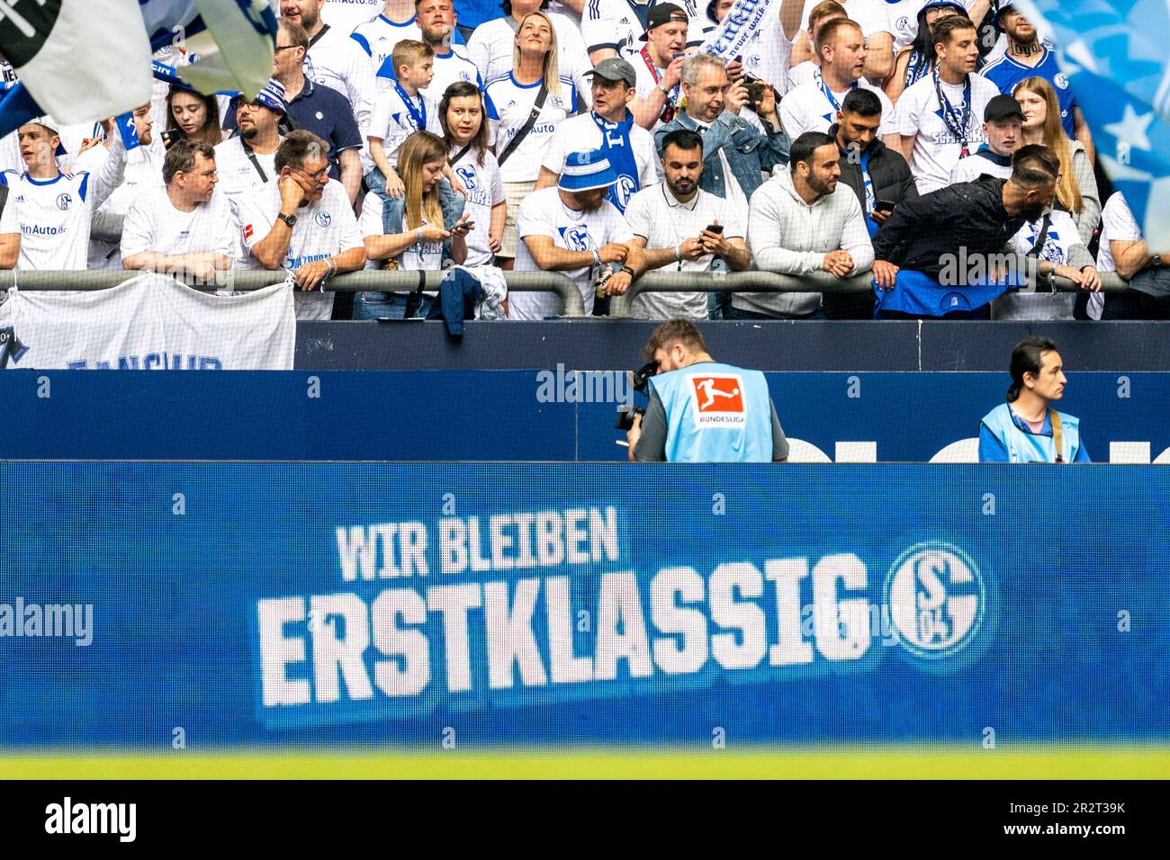 Gelsenkirchen, Germany. 20th May, 2023. Soccer: Bundesliga, FC Schalke 04 - Eintracht Frankfurt, match day 33, Veltins Arena: 'Wir bleiben erstklassig' is written on an advertising board. Credit: David Inderlied/dpa - IMPORTANT NOTE: In accordance with the requirements of the DFL Deutsche Fußball Liga and the DFB Deutscher Fußball-Bund, it is prohibited to use or have used photographs taken in the stadium and/or of the match in the form of sequence pictures and/or video-like photo series./dpa/Alamy Live News Stock Photo