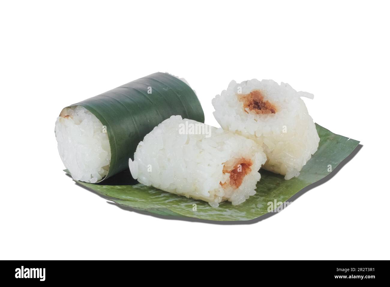 lemper isolated on white background. Indonesian traditional food lemper. Asian culinary lemper. rice cakes with banana leaves and chicken inside Stock Photo