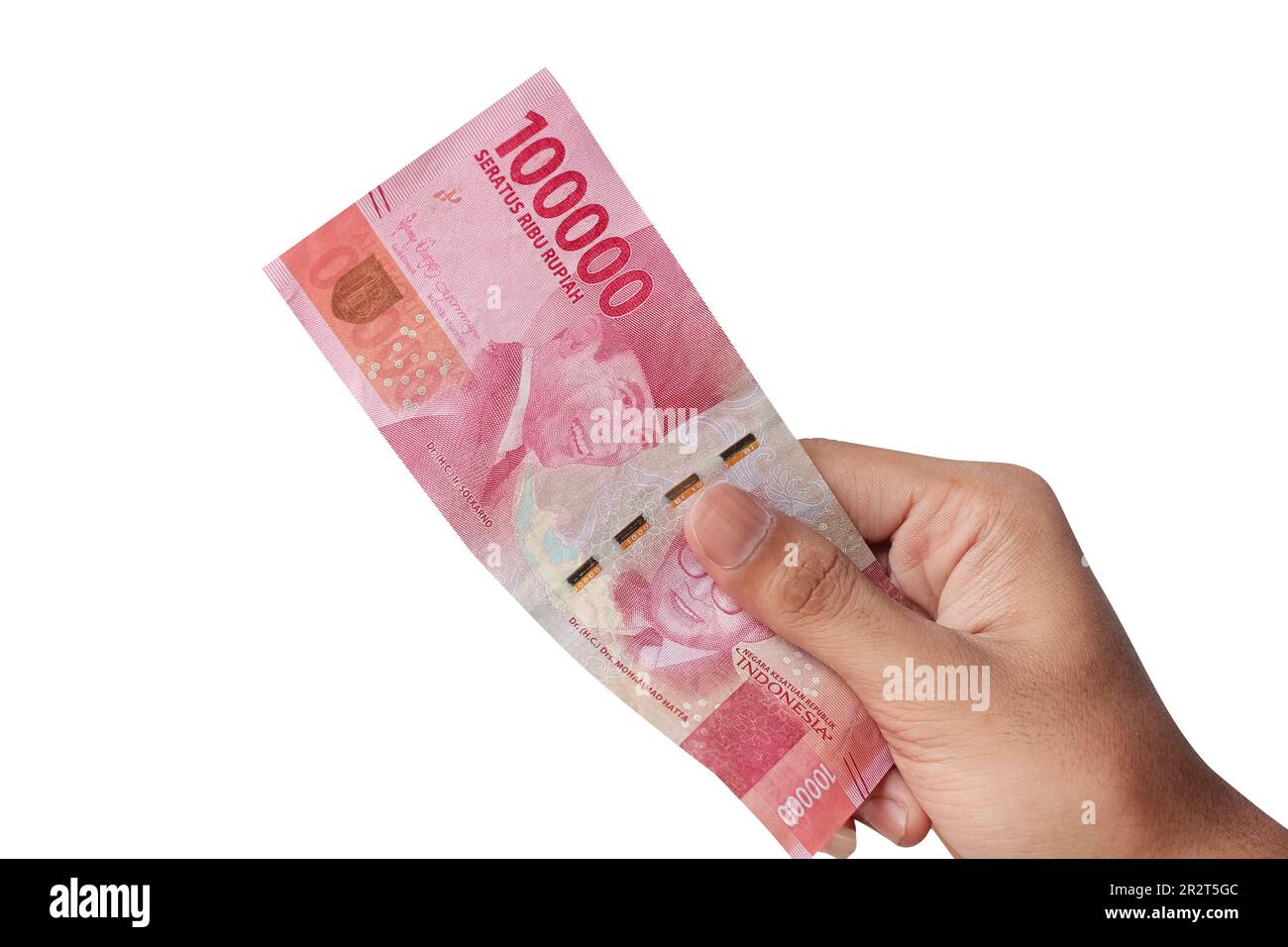 Hand holding one hundred thousand rupiah banknote isolated on a white ...