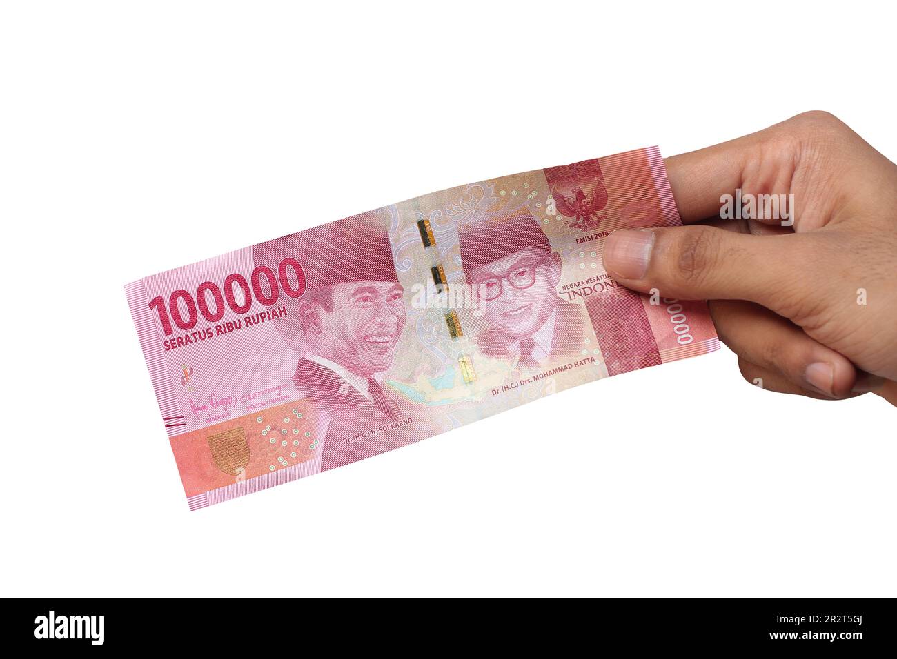 Hand holding one hundred thousand rupiah banknote isolated on a white background. financial concept Stock Photo