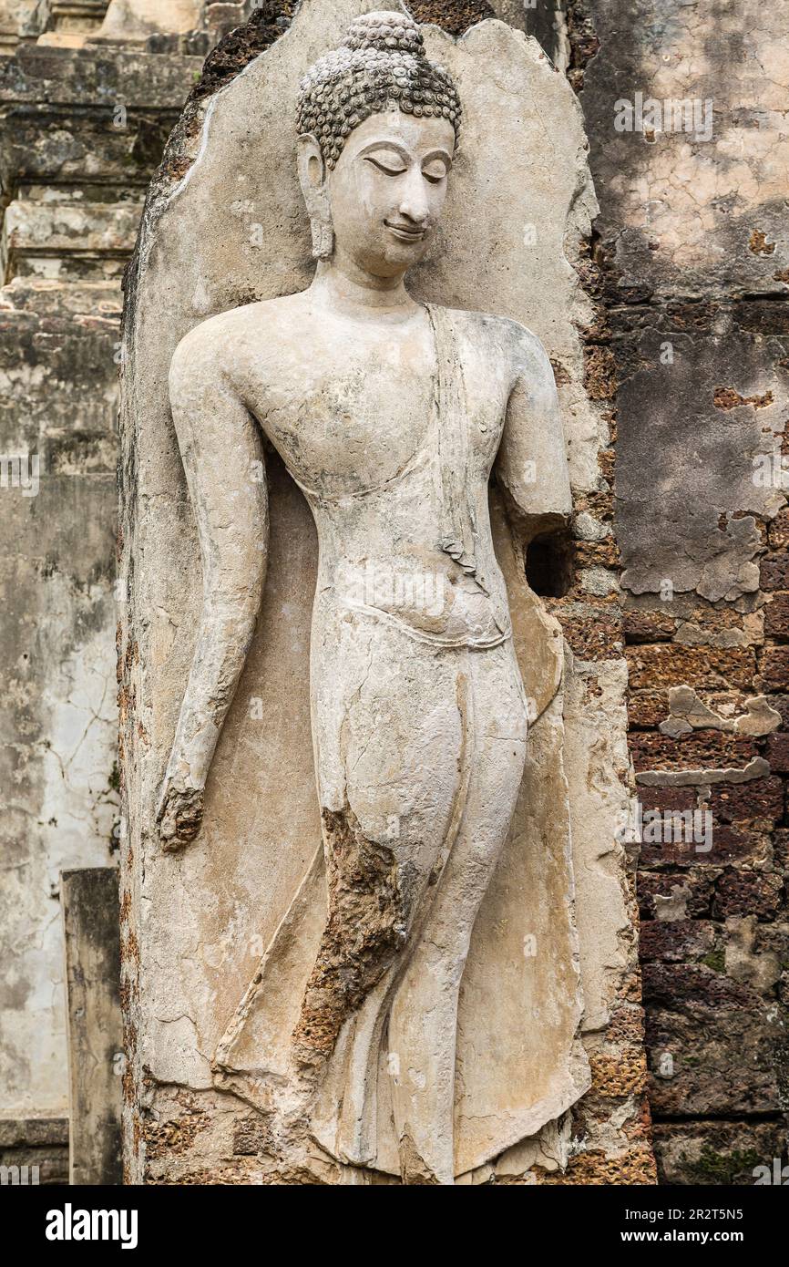 Standing Buddha at Wat Phra Si Rattana Mahathat in Si Satchanalai, Thailand. Stock Photo