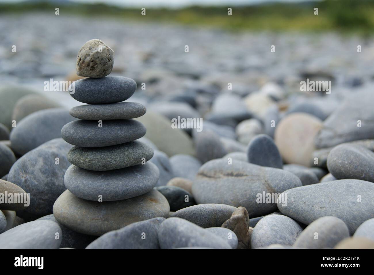 Zen towers on a stony beach. Towers made of pebbles. Stock Photo