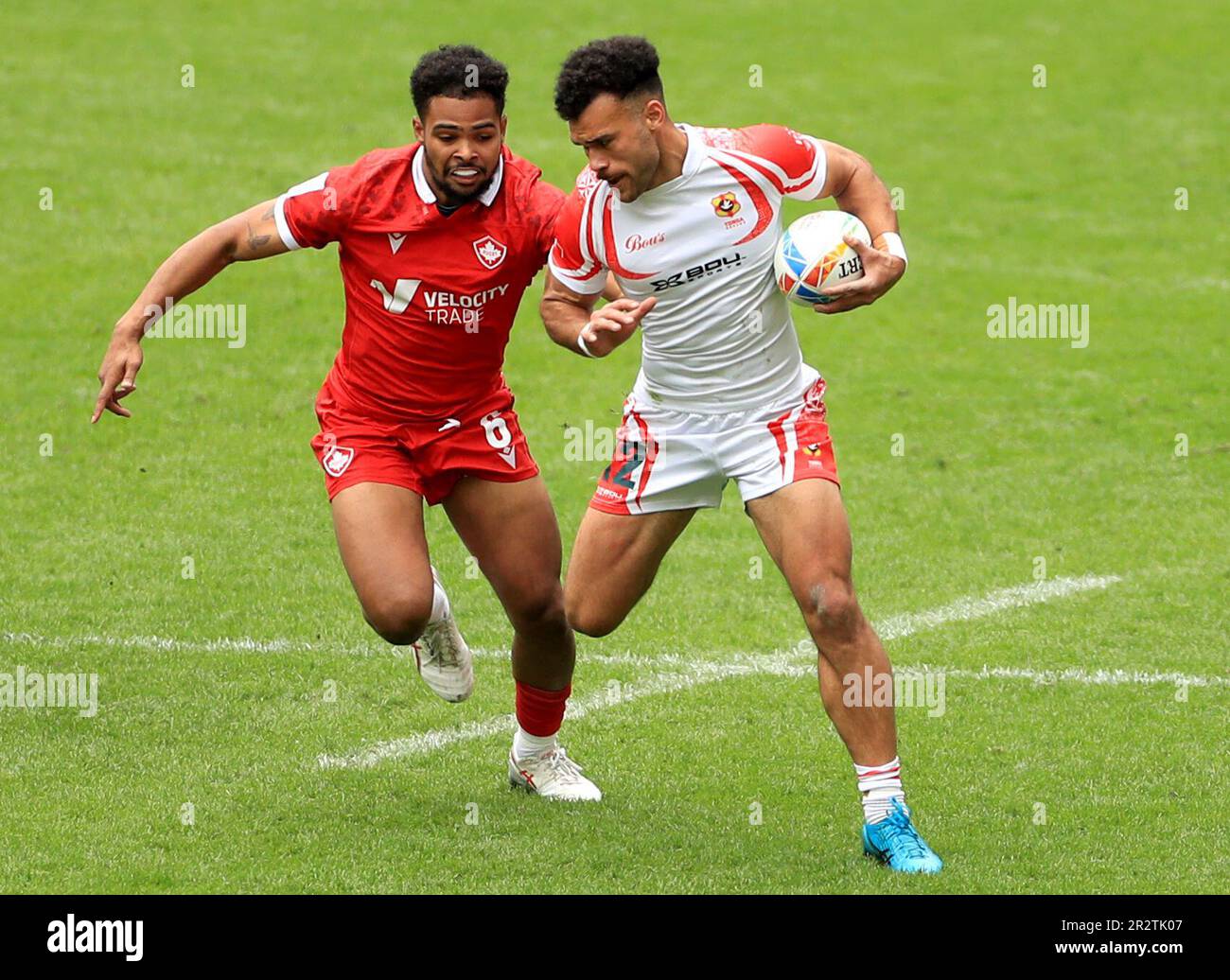 Tonga’s John Tapueluelu is tackled by Canada’s Josiah Morra during game 23 of the HSBC World Rugby Sevens Series at Twickenham Stadium, London. Picture date: Sunday May 21, 2023. Stock Photo
