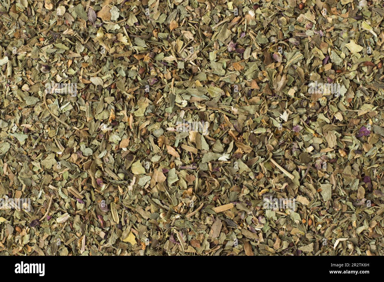 texture of dried marjoram closeup, spice or seasoning as background