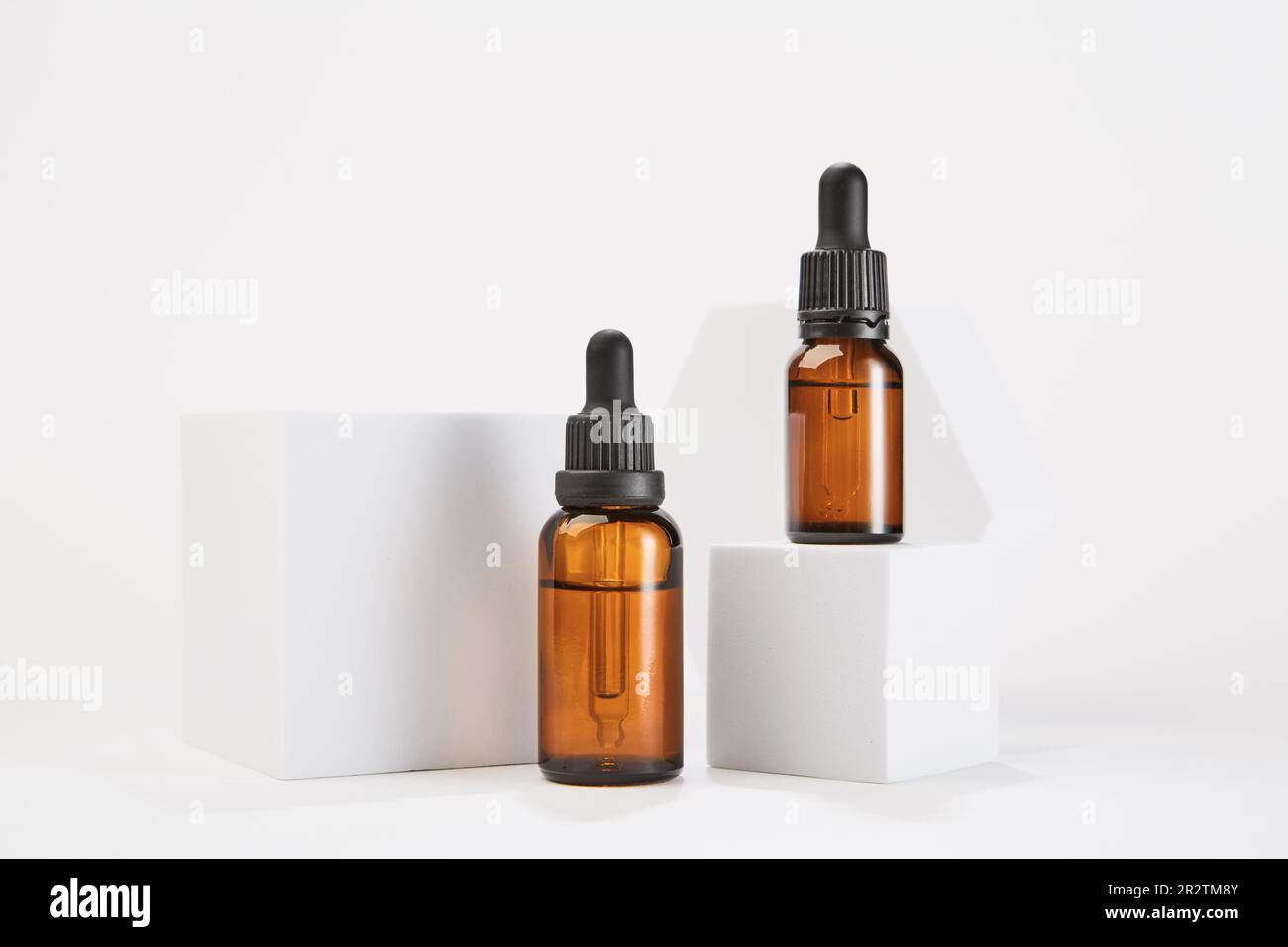 Two amber bottles with dropper pipettes for cosmetology Stock Photo Alamy