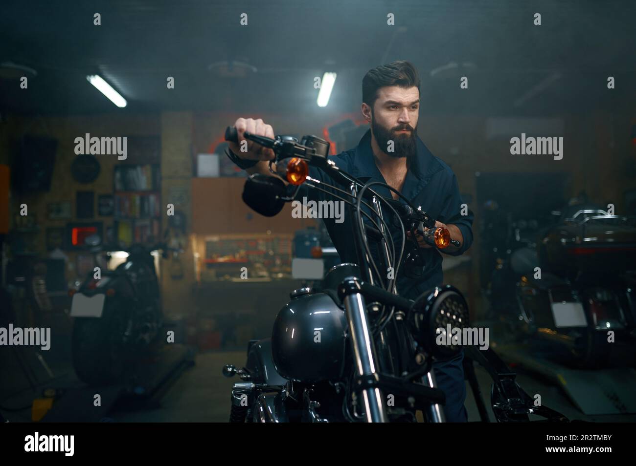 Auto mechanic moving motorcycle hi-res stock photography and images - Alamy