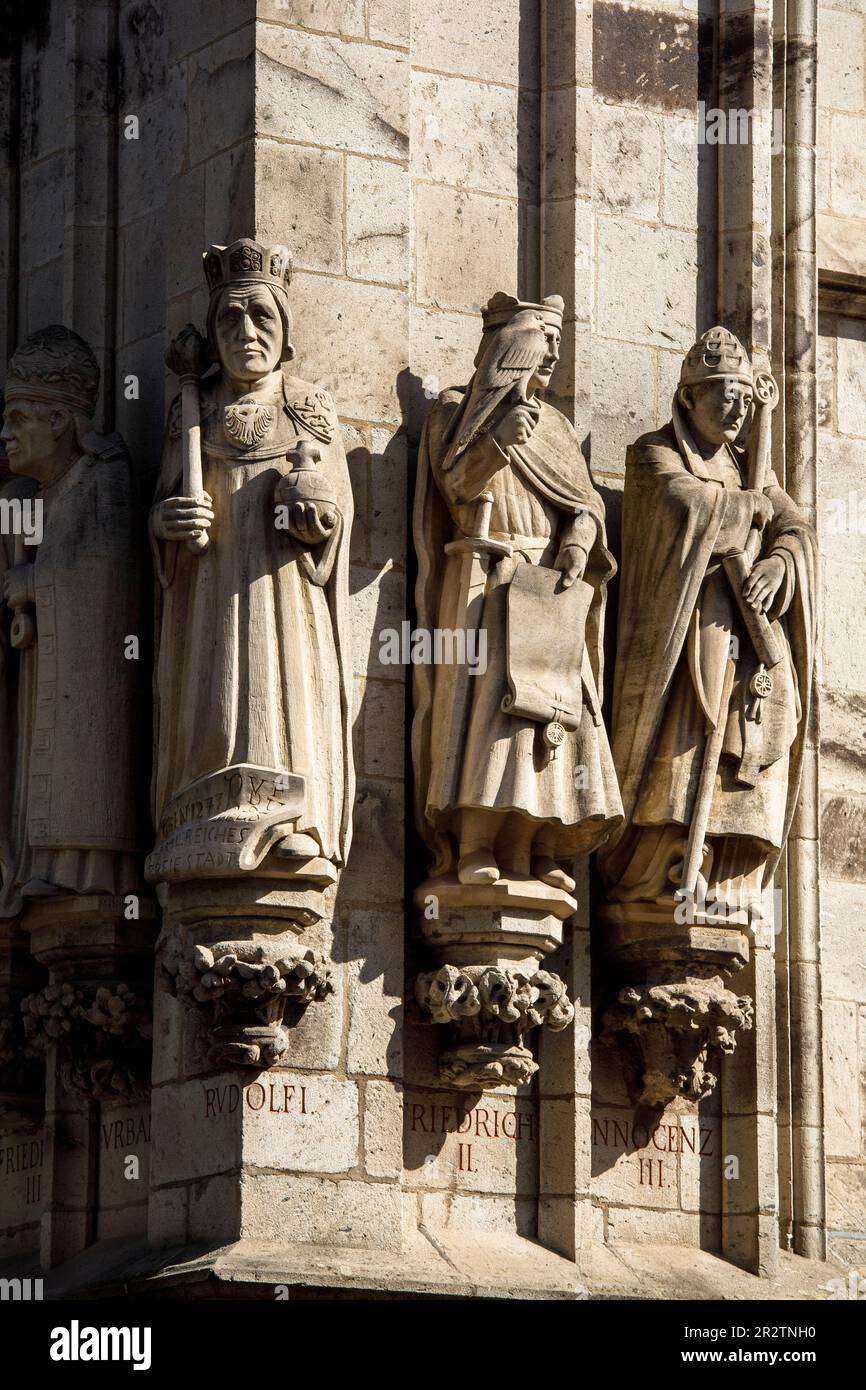 statues of important personalities at the tower of the historical town