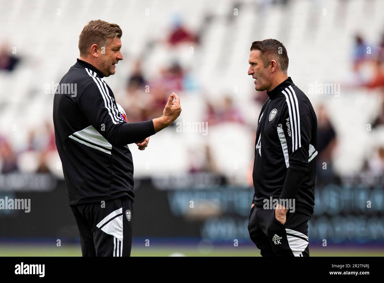 London, UK. 21st May, 2023. Leeds United coaches Karl Robinson (L) & Robbie Keane (R) during the warm up. Premier League match, West Ham Utd v Leeds Utd at the London Stadium, Queen Elizabeth Olympic Park in London on Sunday 21st May 2023 . this image may only be used for Editorial purposes. Editorial use only pic by Lewis Mitchell/Andrew Orchard sports photography/Alamy Live news Credit: Andrew Orchard sports photography/Alamy Live News Stock Photo