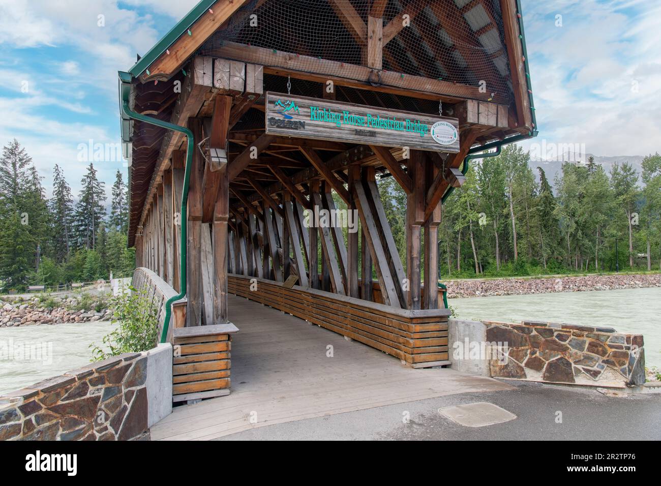 Golden, BC, Canada-August 2022; Entrance view of the Kicking Horse Pedestrian Bridge, the longest freestanding timber frame bridge in Canada, spanning Stock Photo