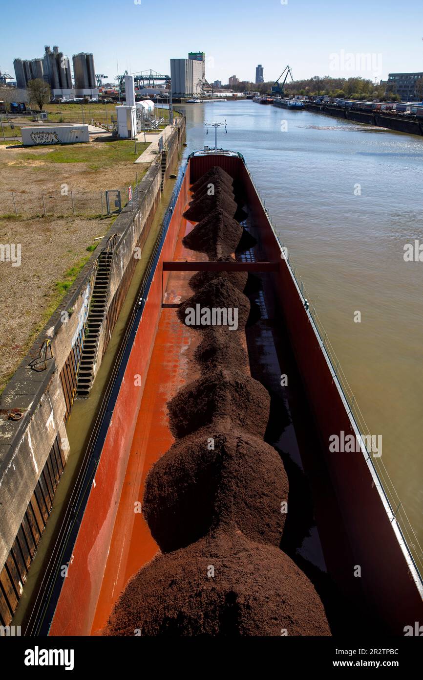 cargo ship with bulk material in the Rhine port Niehl, Cologne, Germany